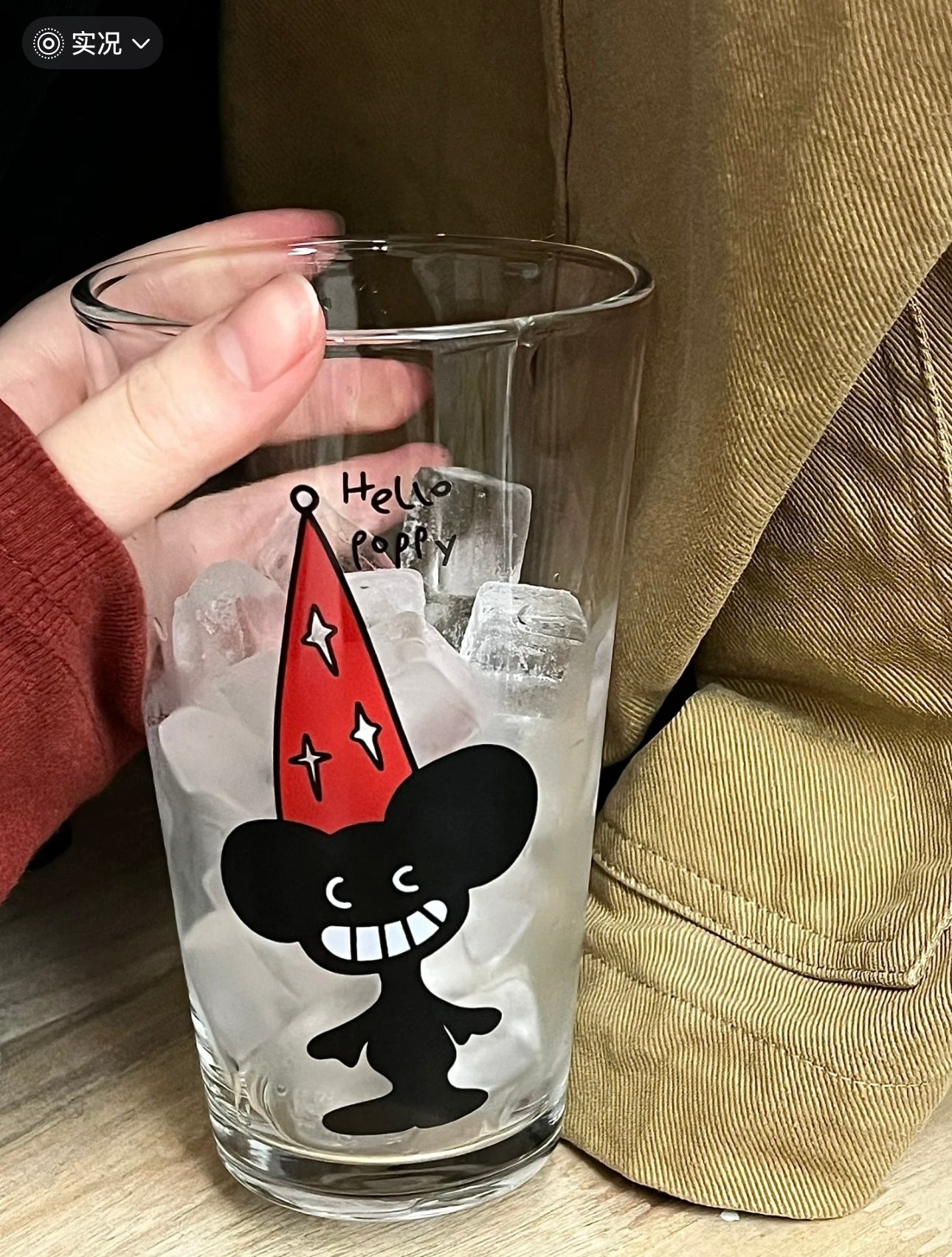 Glass Cup with Red Hat Design